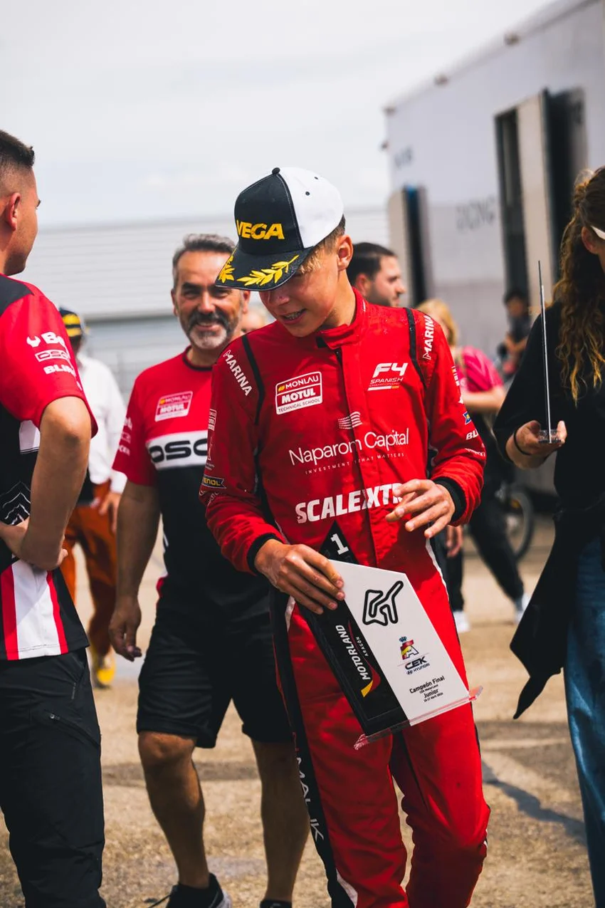 Nilas Malik holding his first-place Junior trophy at MotorLand Aragón